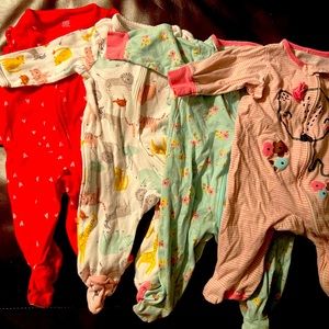 Bundle of four size 3 months footed pajamas. Carters